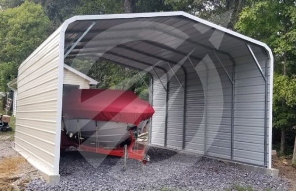 Boat under metal cover on gravel