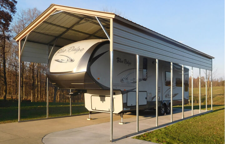 Travel trailer RV parked under carport